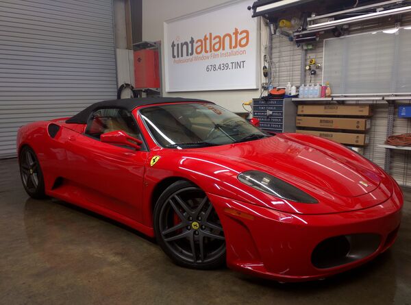 Red Ferrari F430 Spider convertible with premium window film at tintsaltlake shop